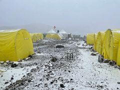 01C The tents of Ak-Sai Travel Lenin Peak Camp 1 4400m in snowy conditions